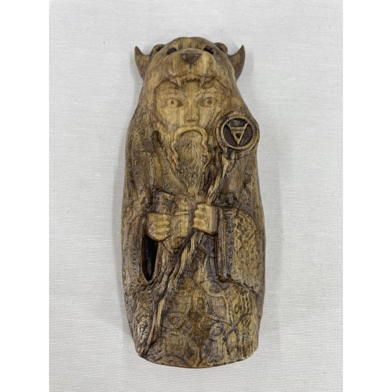 Статуетка слов“янського бога Велес мала дерево