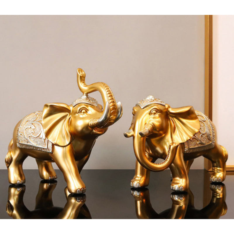 Пара слонів у золотому кольорі