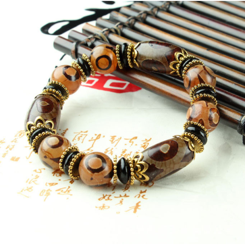 Браслет дев“ять коричневих триоких ДЗІ