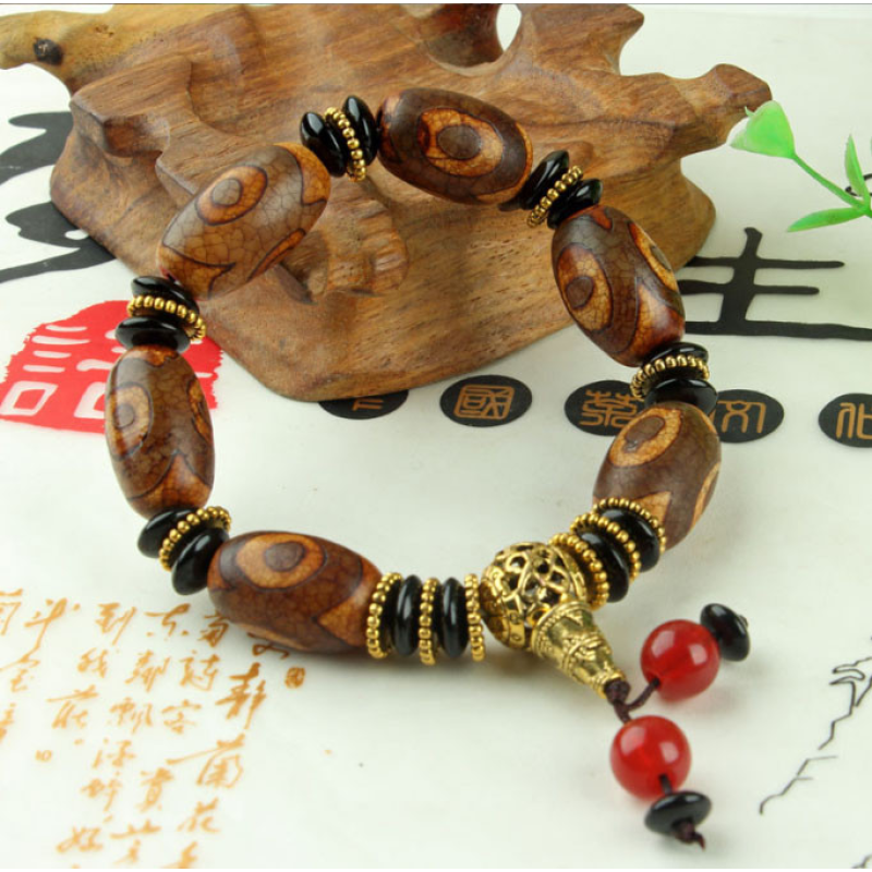 Браслет шість коричневих триоких ДЗІ з пензликом Браслет шість коричневих триоких ДЗІ з пензликом