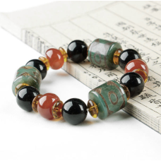 Браслет три зелені бочонки на 3 ока