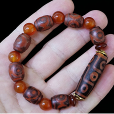 Браслет сім триоких ДЗІ одна на 9 очей