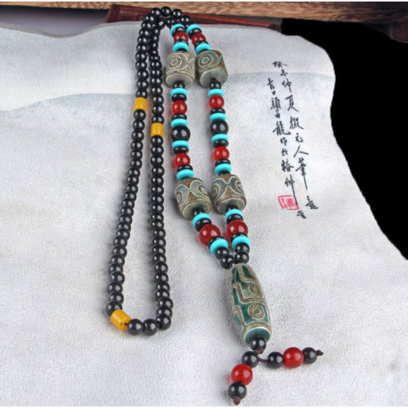 Кольє Зелено-коричнева ДЗІ 9 очей і чотири бочонки на 3 ока Кольє Зелено-коричнева ДЗІ 9 очей і чотири бочонки на 3 ока