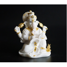 Статуетка Ганеш пише книгу