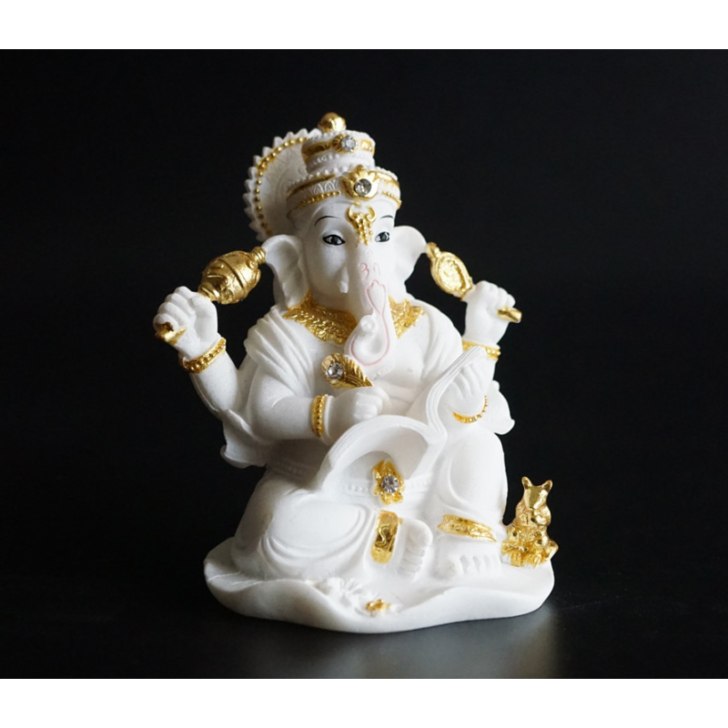 Статуетка Ганеш пише книгу