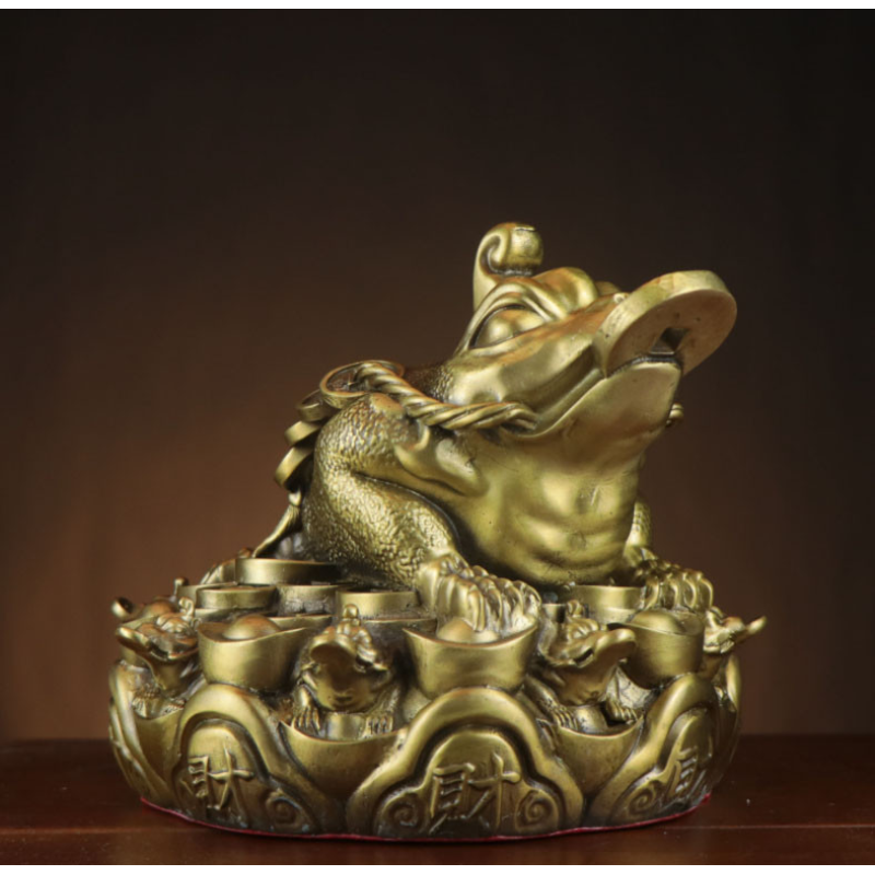 Жаба багатства на чашах достатку велика